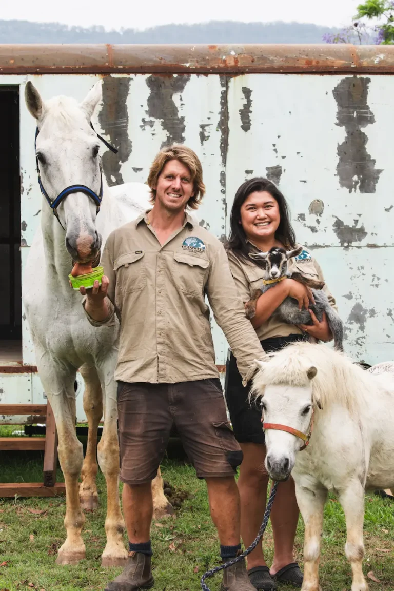 Clandulla farmstay owners with horse, goat, and pony at farm.