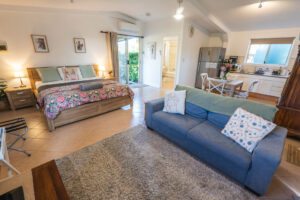 Bottlebrush cottage spacious open-plan bedroom and lounge with kitchenette at farmstay.